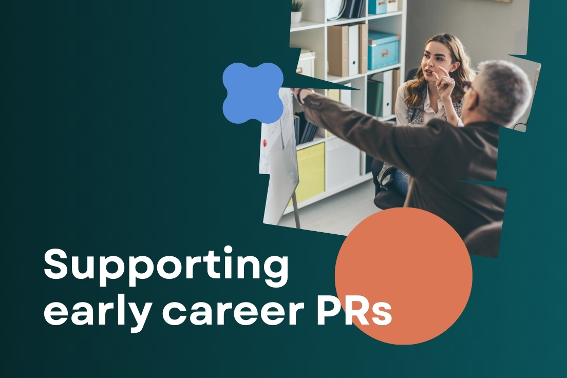 A middle-aged PR professional pointing to a whiteboard to show a young PR professional with blonde hair the latest trends in PR. The image is surrounded by a dark green background and there's an orange circle. The text says: Supporting early careers PR